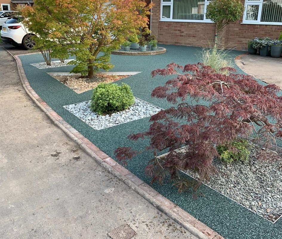 Original Progreen project with considered planting, ornamental trees and decorative garden surfacing